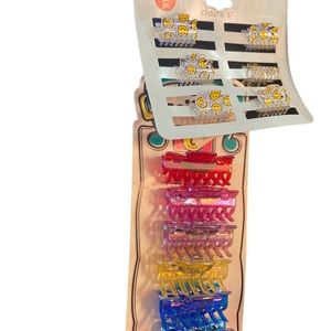 Scunci Vintage Hair Clips ones that is colorful and one set has smiley faces NWT